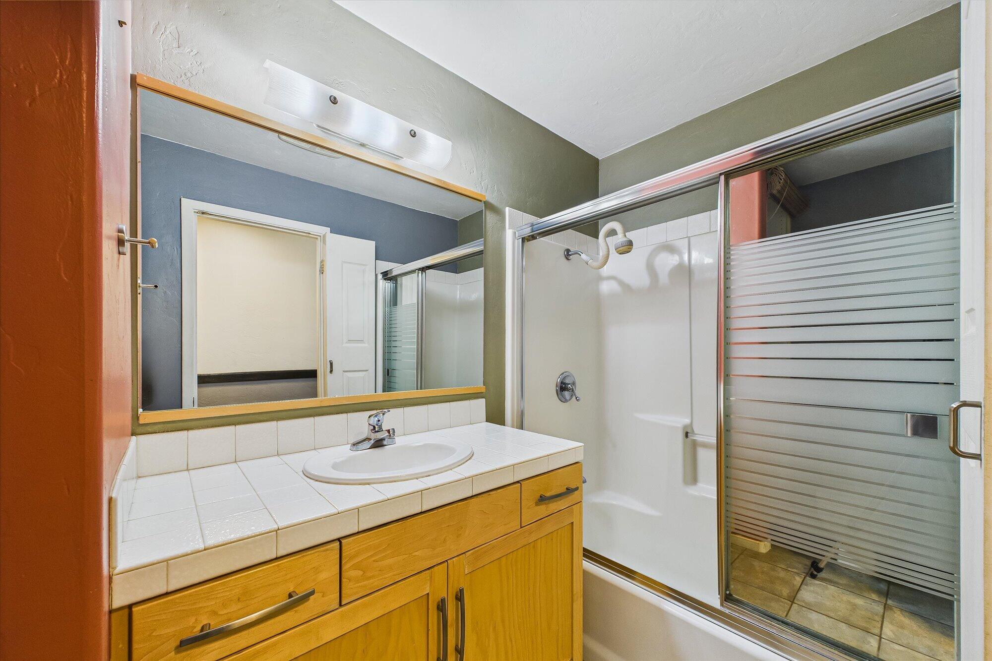 1945 Grange Road McKinleyville, CA 95519 - Photo 30 of 62 a bathroom with a sink shower and a mirror