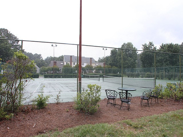8108 Mourning Dove Road Raleigh, NC 27615 - Photo 24 of 25 SUMMERFIELD NORTH HAS THIER OWN TENNIS COURT FOR MEMEBRS AND A TENNIS PRO TEACHES YOUTH AND ADULT LESSONS SEVERAL TIMES A YEAR. Tennis Court