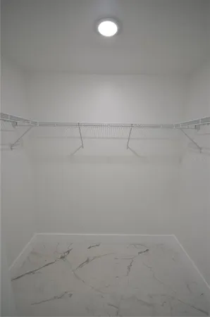 a bathroom with double sink a mirror and shower
