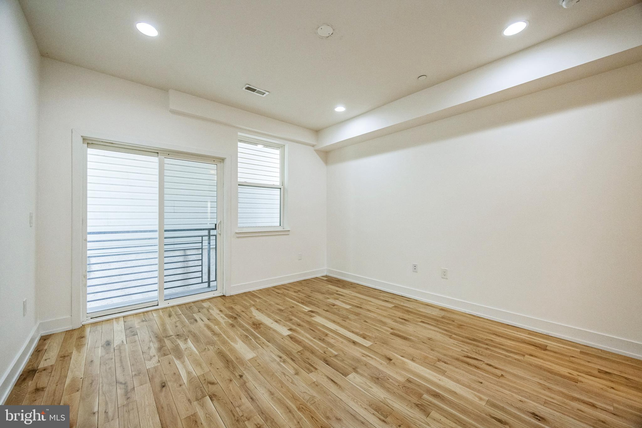 614 Master Street, Unit 2 Philadelphia, PA 19122 - Photo 15 of 29 wooden floor in an empty room with a window