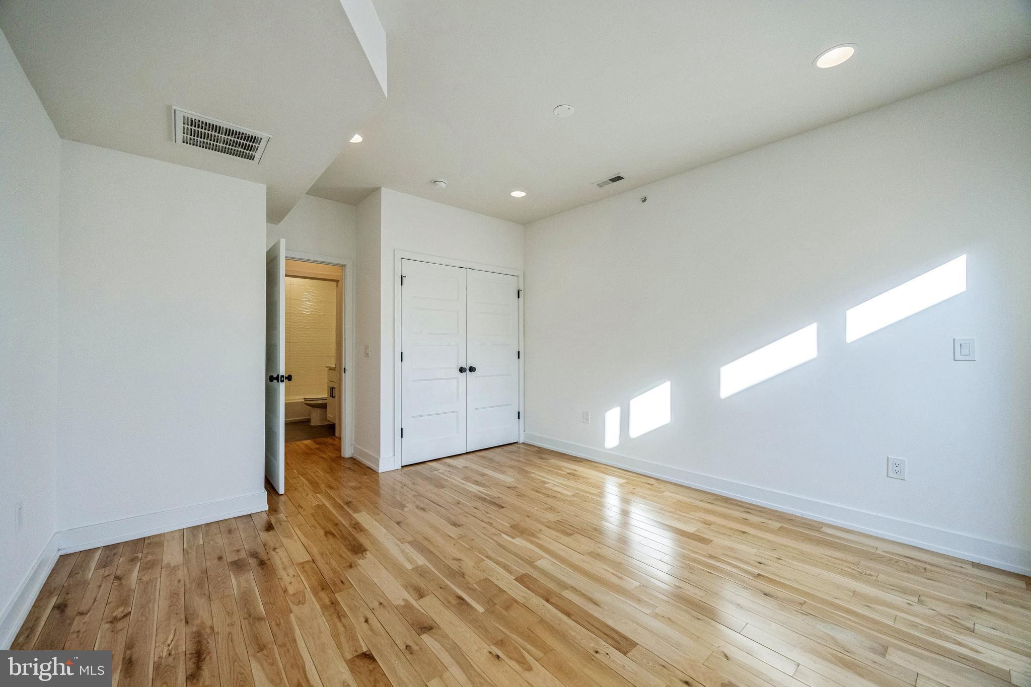 614 Master Street, Unit 2 Philadelphia, PA 19122 - Photo 19 of 29 a view of empty room with wooden floor