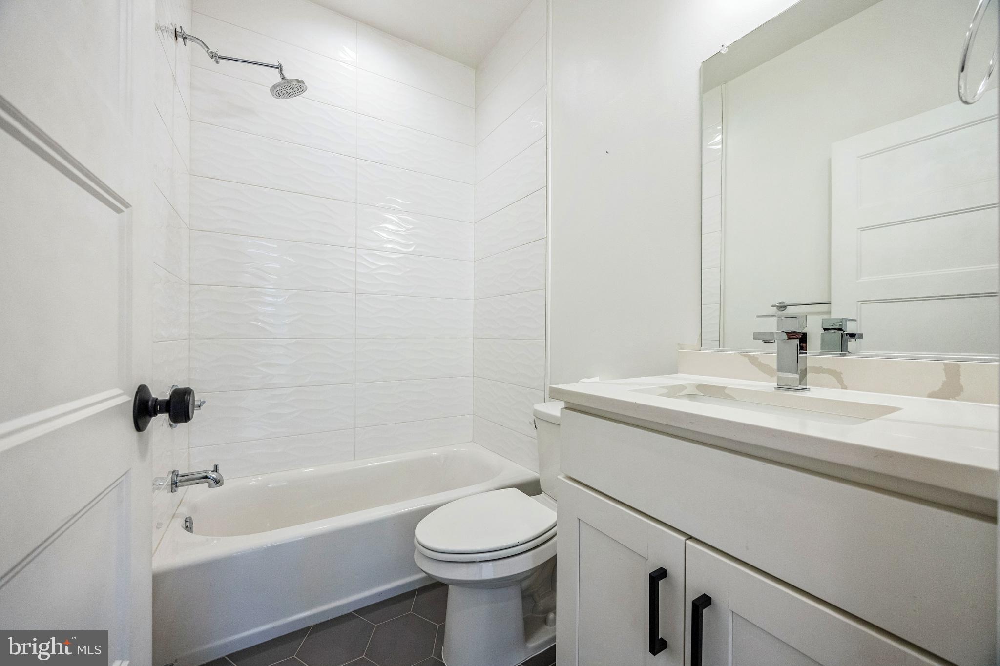 614 Master Street, Unit 2 Philadelphia, PA 19122 - Photo 21 of 29 a bathroom with a sink a toilet and a bathtub