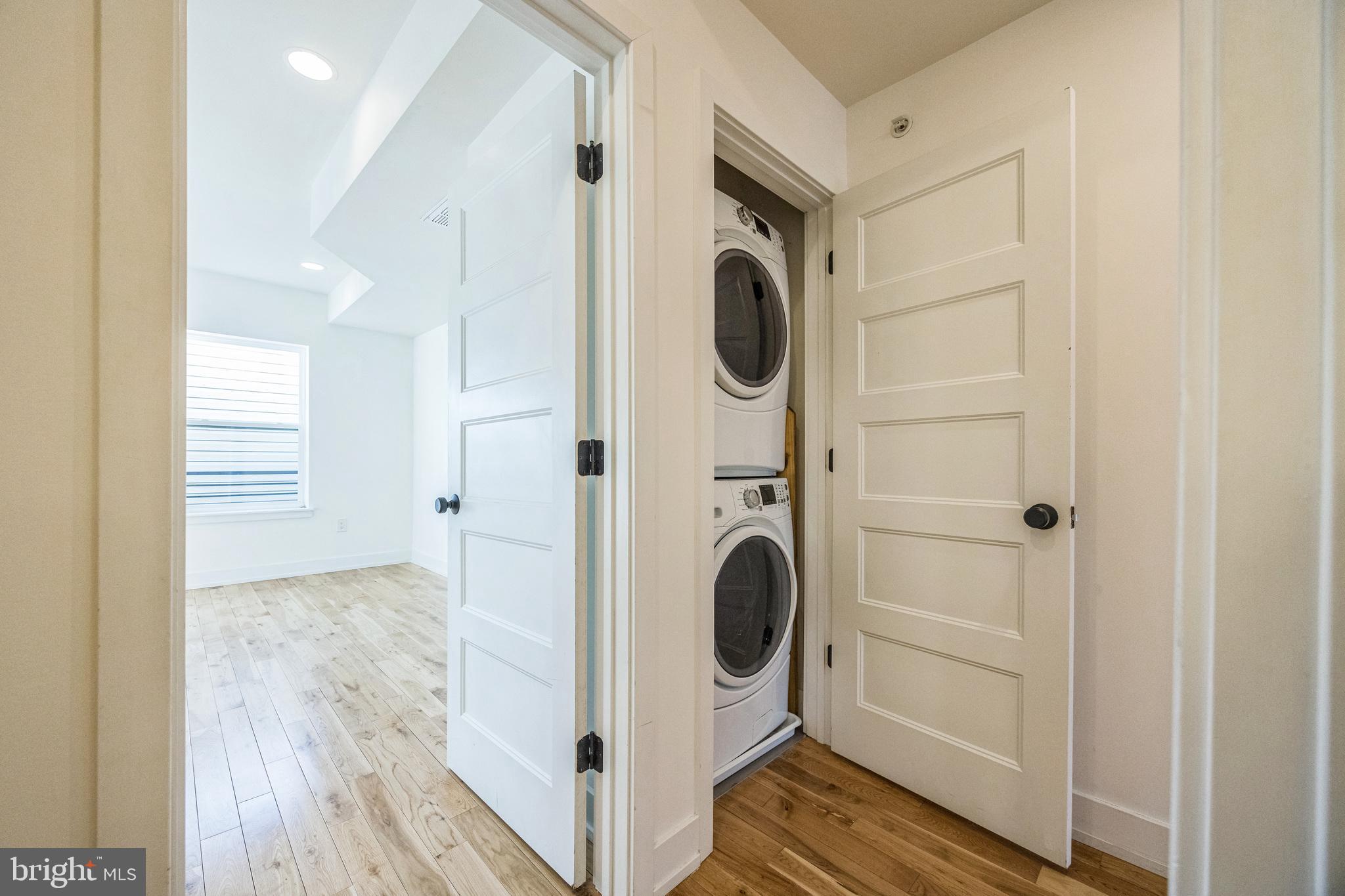614 Master Street, Unit 2 Philadelphia, PA 19122 - Photo 22 of 29 a view of a storage & utility room with washer and dryer