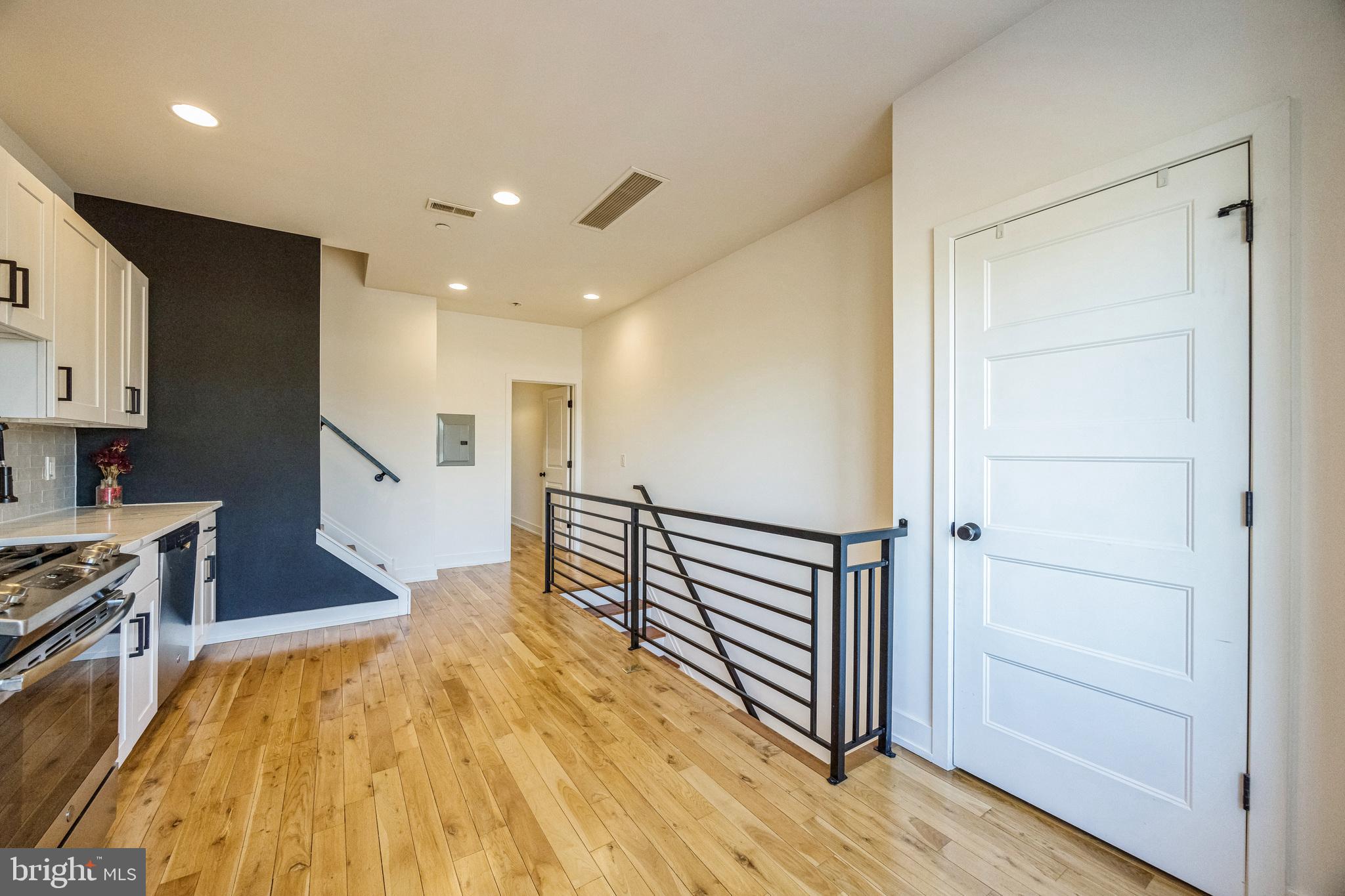 614 Master Street, Unit 2 Philadelphia, PA 19122 - Photo 4 of 29 a view of kitchen with wooden floor and electronic appliances