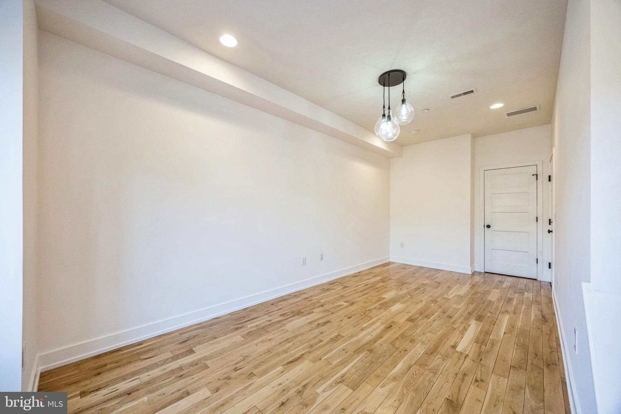 614 Master Street, Unit 2 Philadelphia, PA 19122 - Photo 8 of 29 a view of a room with a ceiling fan and wooden floor