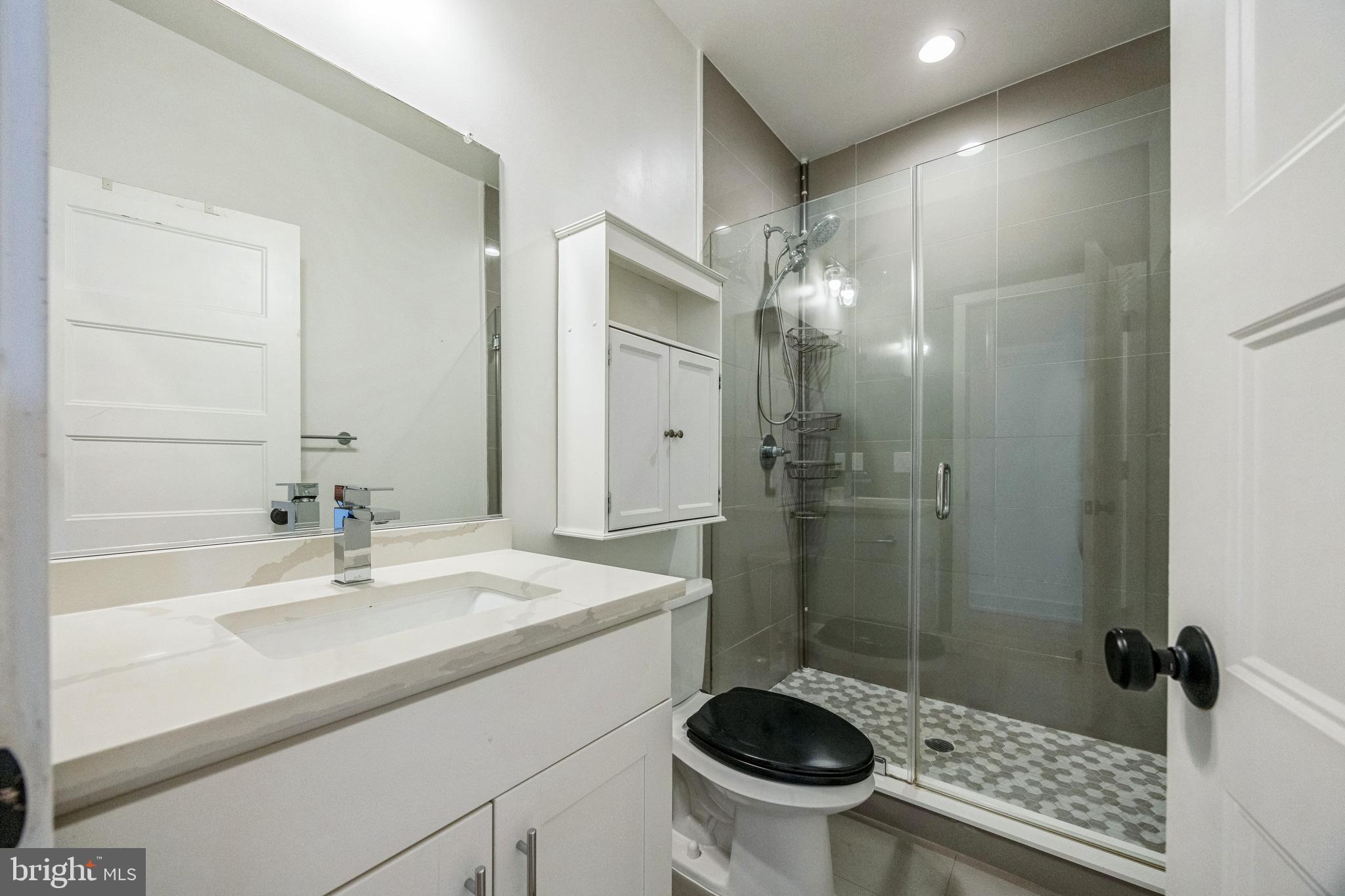 614 Master Street, Unit 2 Philadelphia, PA 19122 - Photo 10 of 29 a bathroom with a sink a toilet and shower