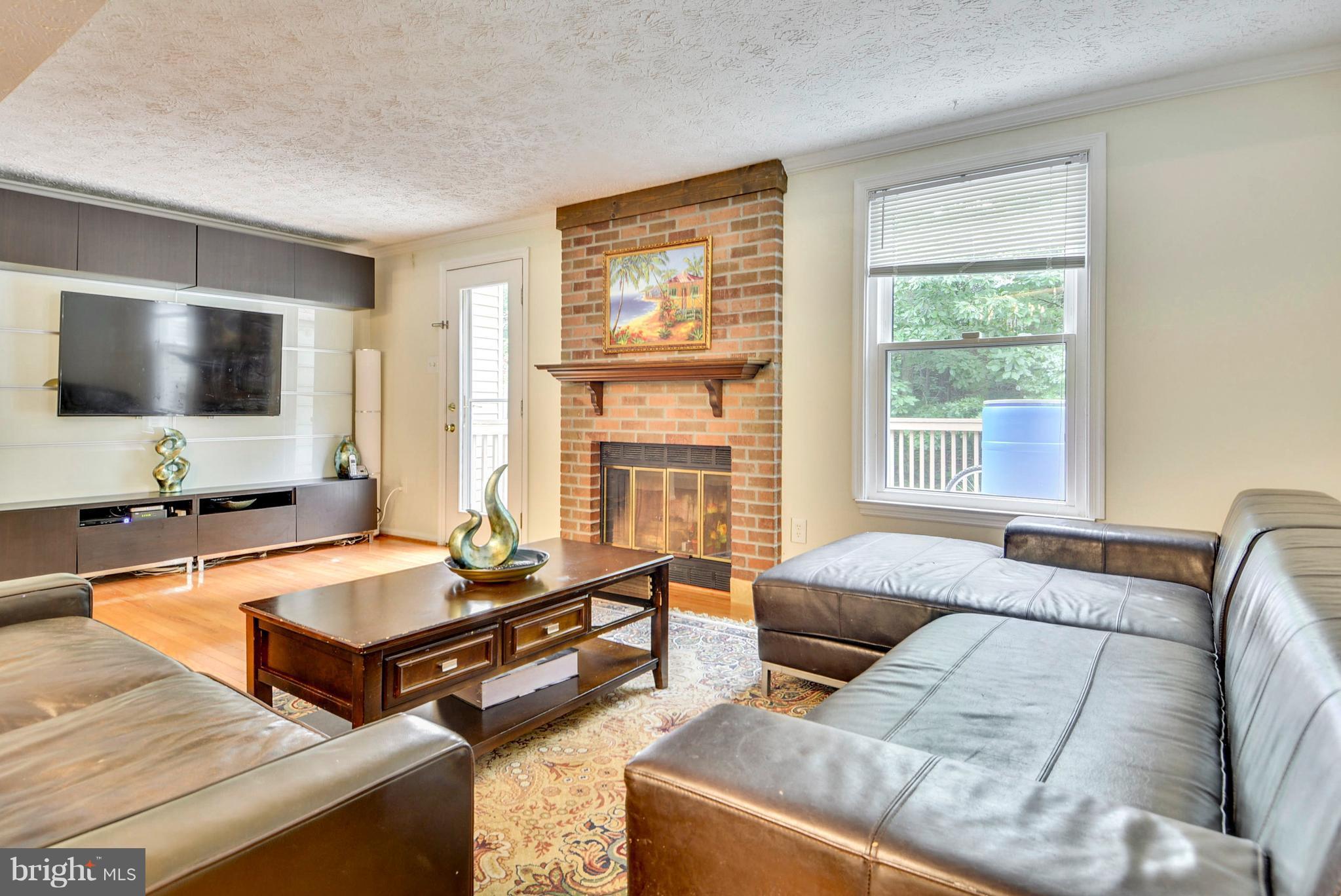 7526 Mandan Road Greenbelt, MD 20770 - Photo 4 of 21 Living Room w/ wood burning fireplace
