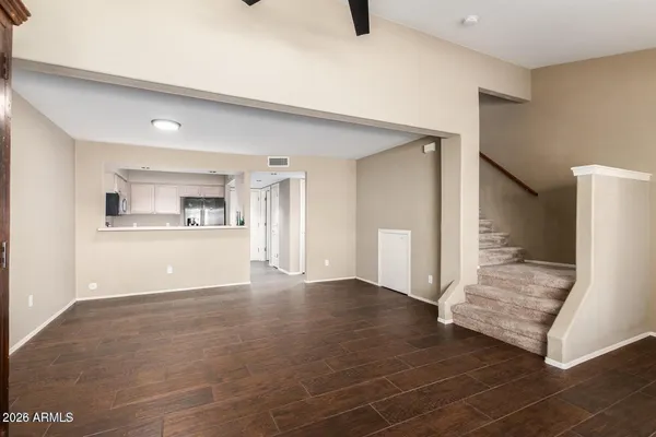a view of a kitchen with wooden floor and a kitchen