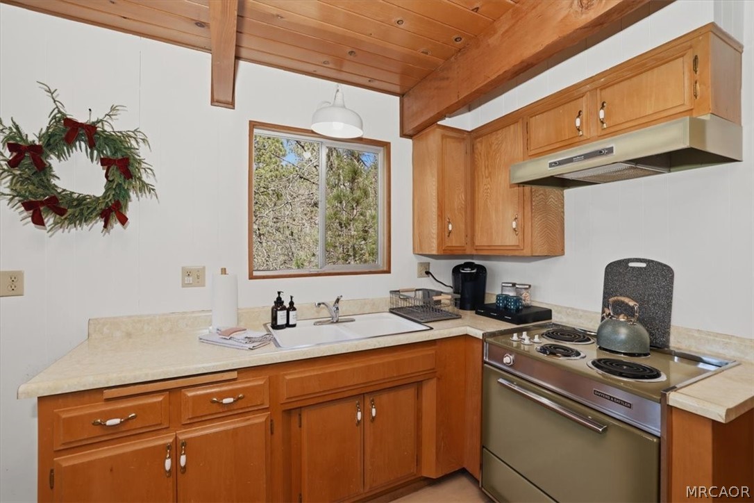 1146 Ridge Road Fawnskin, CA 92333 - Photo 11 of 34 a kitchen with a sink cabinets and a window