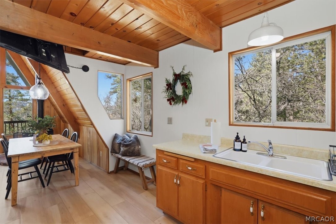 1146 Ridge Road Fawnskin, CA 92333 - Photo 13 of 34 a spacious bathroom with a granite countertop sink and a window