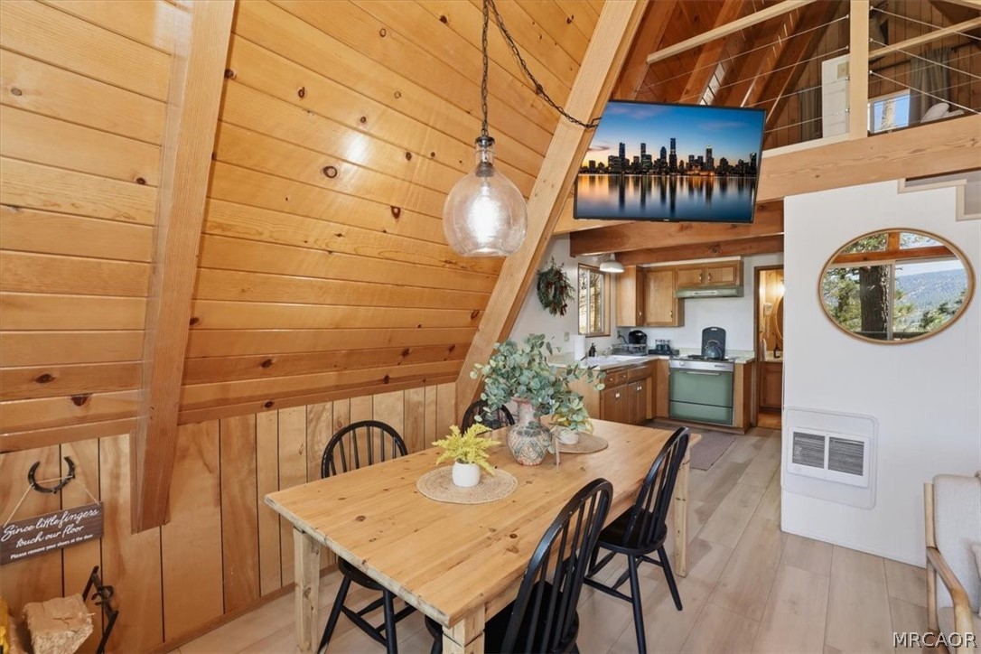 1146 Ridge Road Fawnskin, CA 92333 - Photo 14 of 34 a view of a dining room with furniture and chandelier
