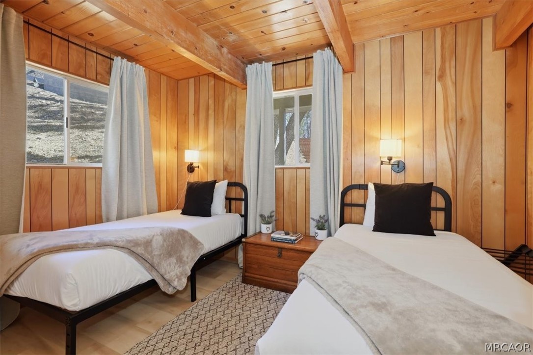 1146 Ridge Road Fawnskin, CA 92333 - Photo 15 of 34 a bedroom with a large bed and a window