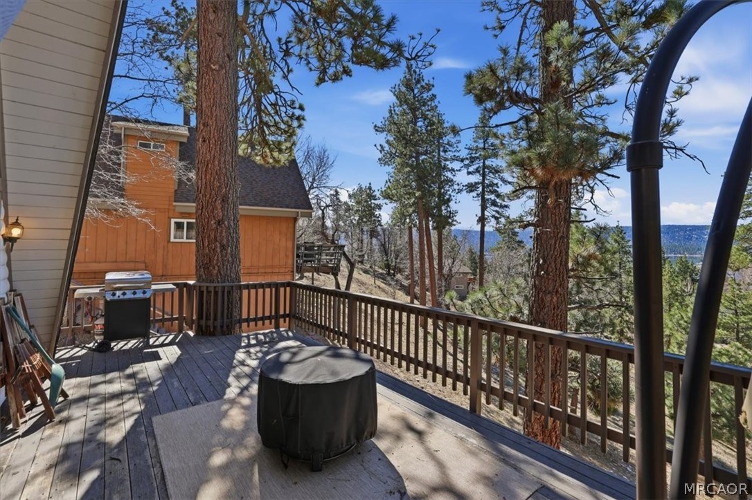 1146 Ridge Road Fawnskin, CA 92333 - Photo 21 of 34 a view of a two chairs and table in the balcony