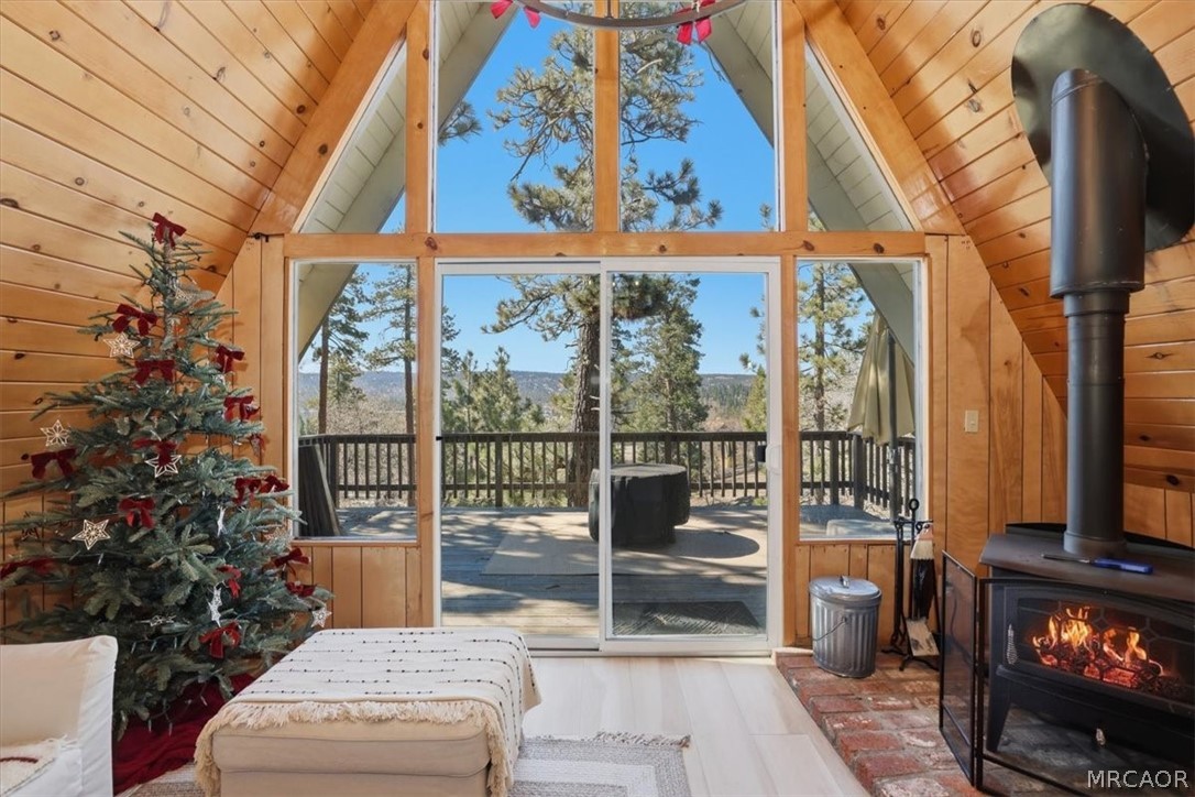 1146 Ridge Road Fawnskin, CA 92333 - Photo 3 of 34 a living room with large windows