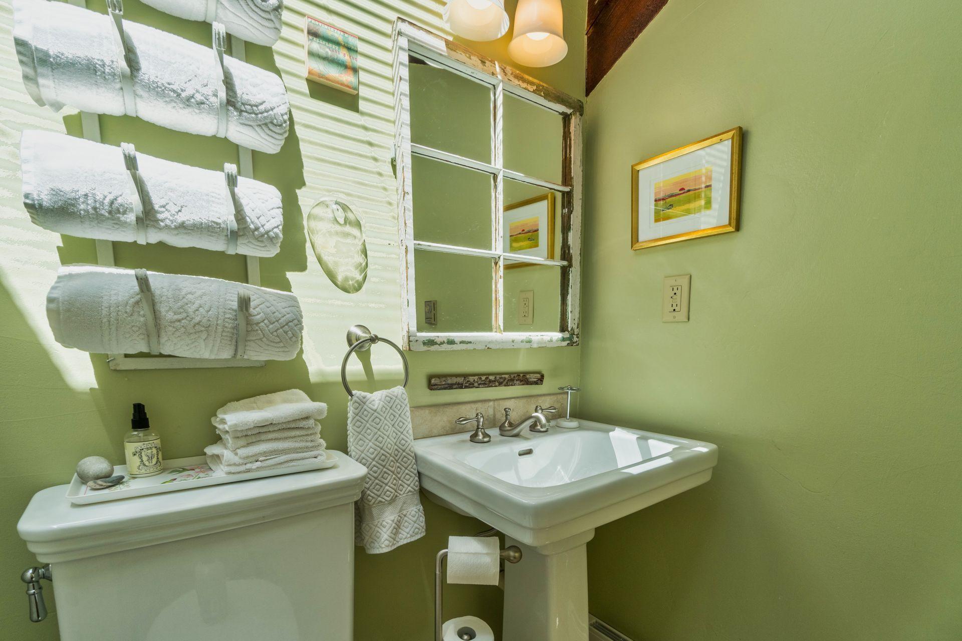 19 Resolution Road Truro, MA 02666 - Photo 23 of 32 a bathroom with a sink and a mirror
