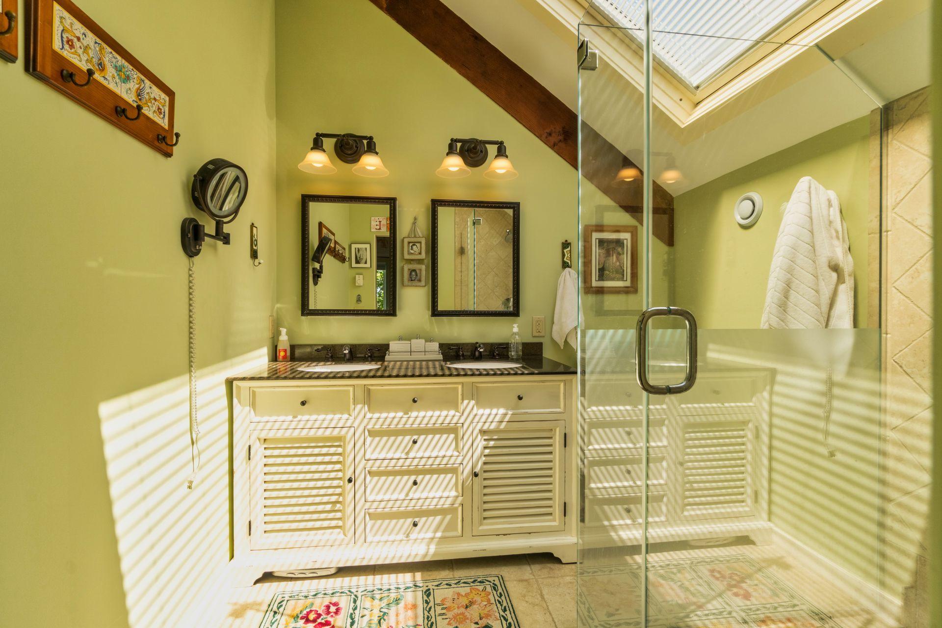 19 Resolution Road Truro, MA 02666 - Photo 24 of 32 a bathroom with a mirror and shower