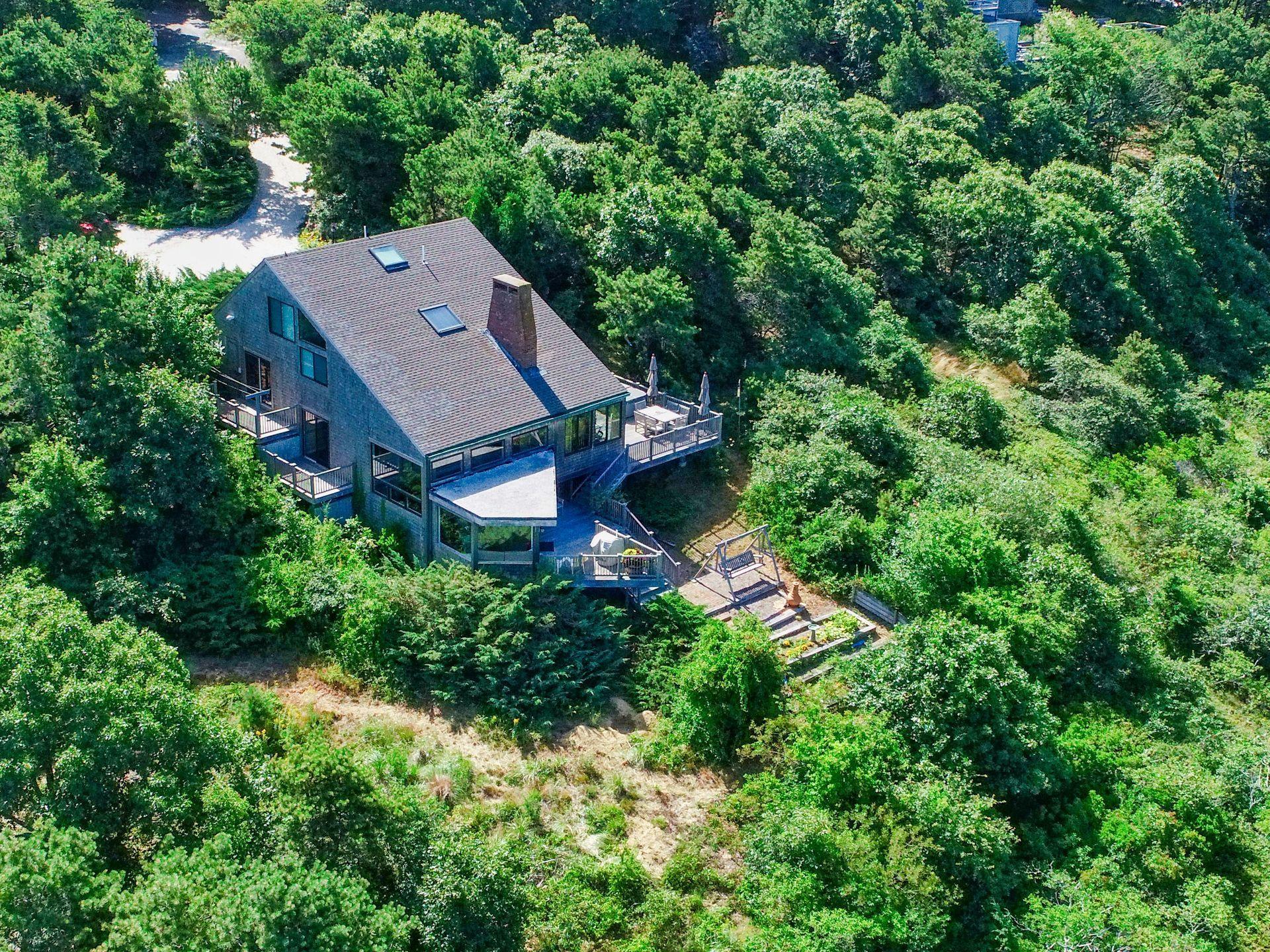 19 Resolution Road Truro, MA 02666 - Photo 4 of 32 an aerial view of a house with yard and outdoor seating