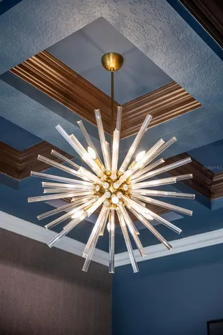 a spacious bedroom with a bed a couch and a large window