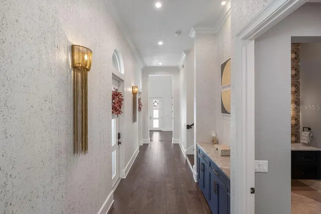 a spacious bathroom with a double vanity sink a mirror a bathtub and shower