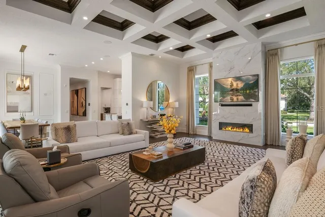 a room with furniture a rug and a book shelf