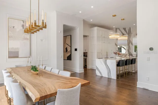 a view of a dining room with furniture and a window