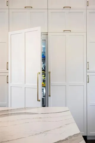 an aerial view of a house with a garden and trees