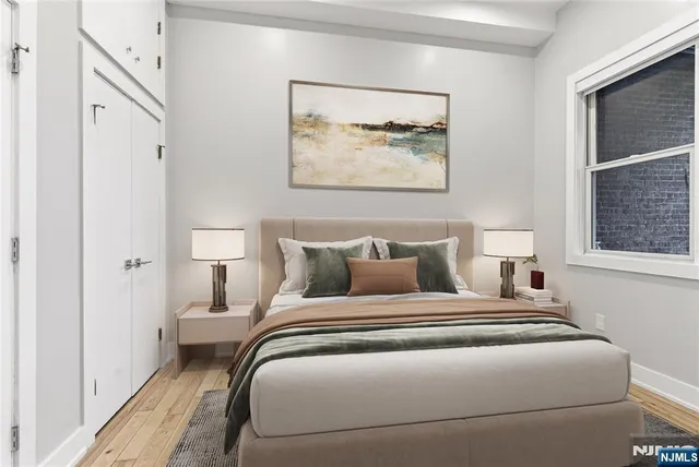 a bedroom with bed and a window