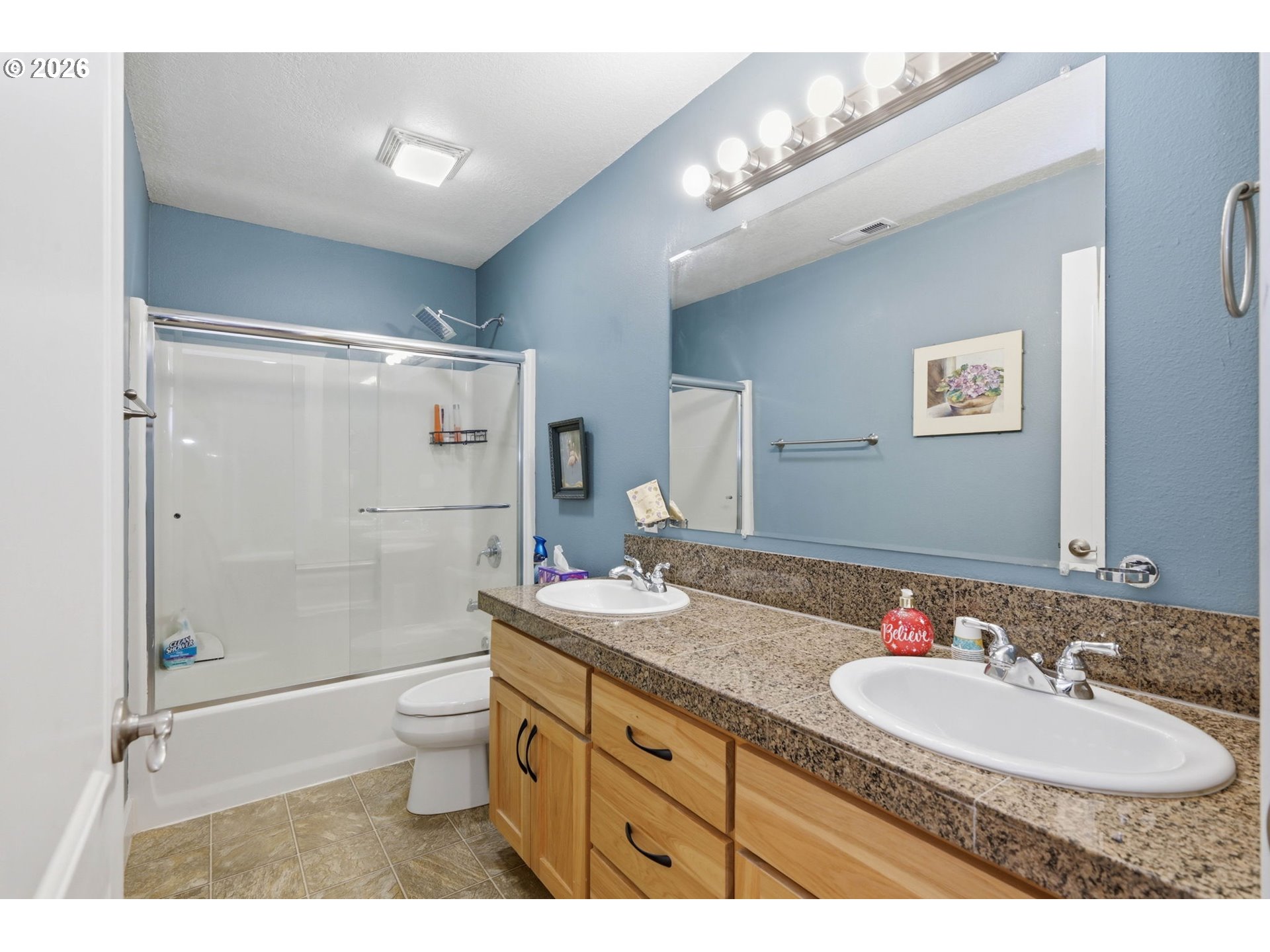 29778 Gimpl Hill Road Eugene, OR 97405 - Photo 27 of 43 a bathroom with a granite countertop sink mirror toilet and shower