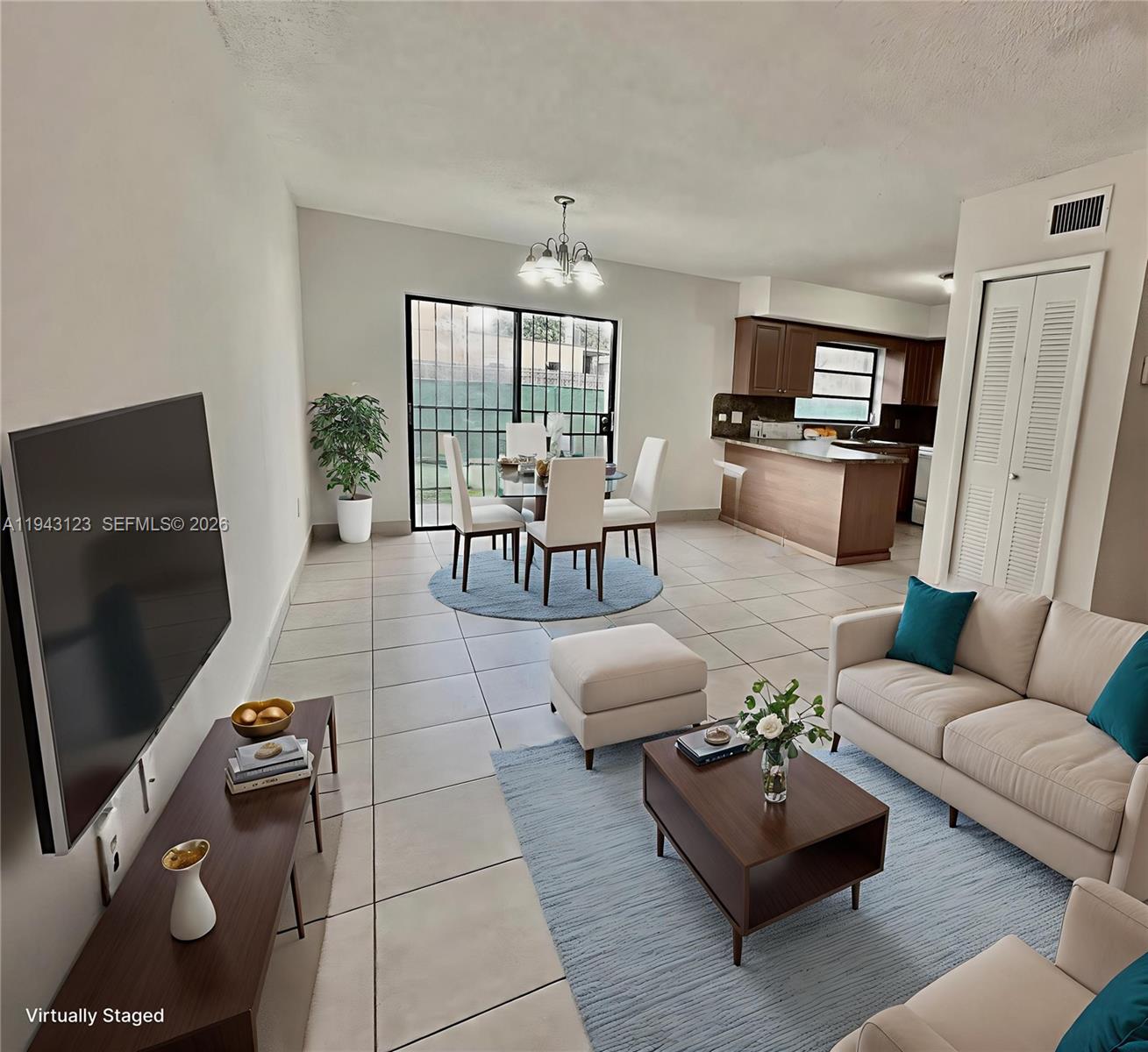 a living room with furniture and a flat screen tv