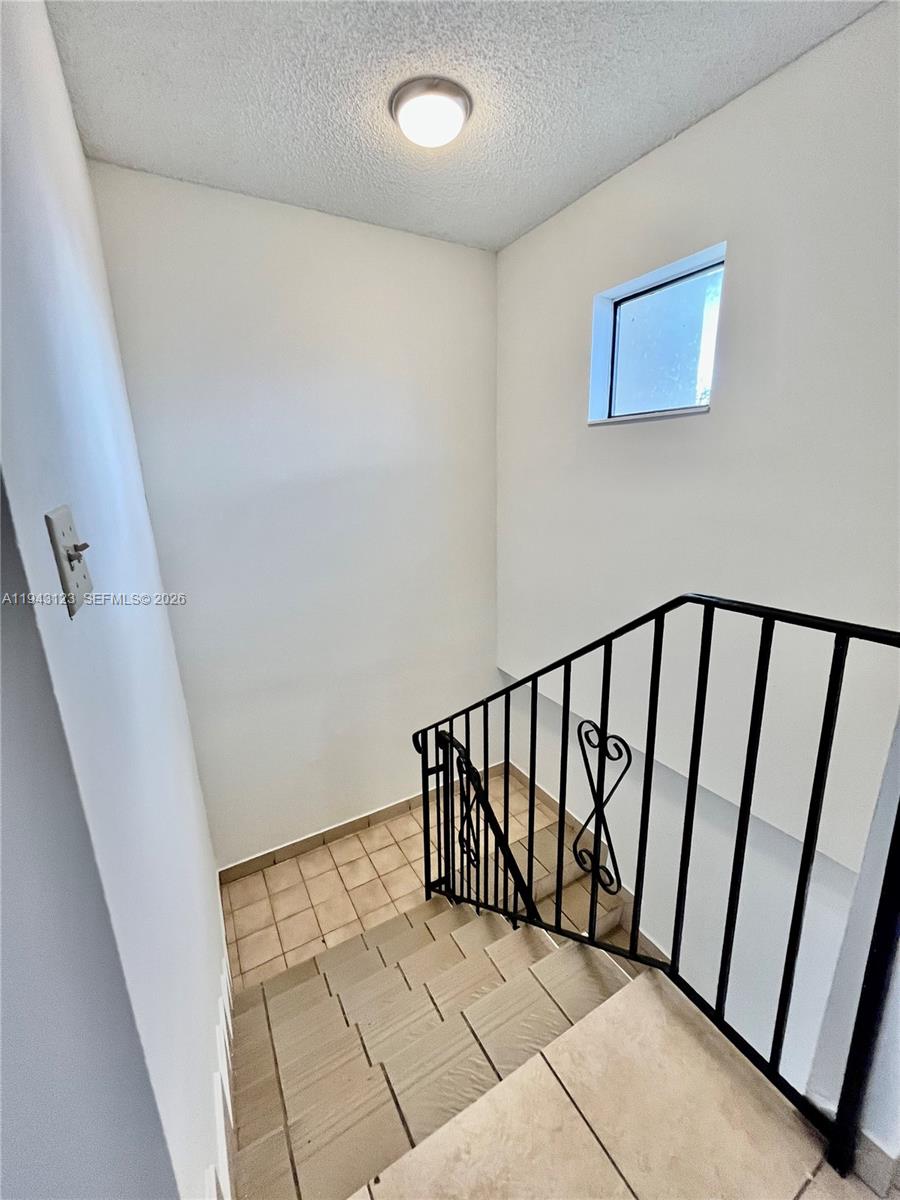1127 West 37th Street Hialeah, FL 33012 - Photo 13 of 16 a view of a staircase