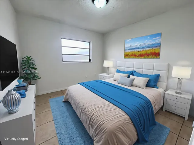 a bedroom with bed and a couch
