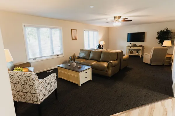 a living room with furniture and a flat screen tv