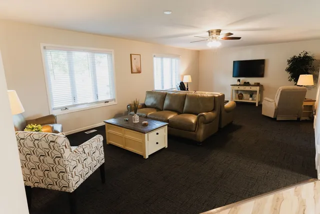 a living room with furniture and a flat screen tv