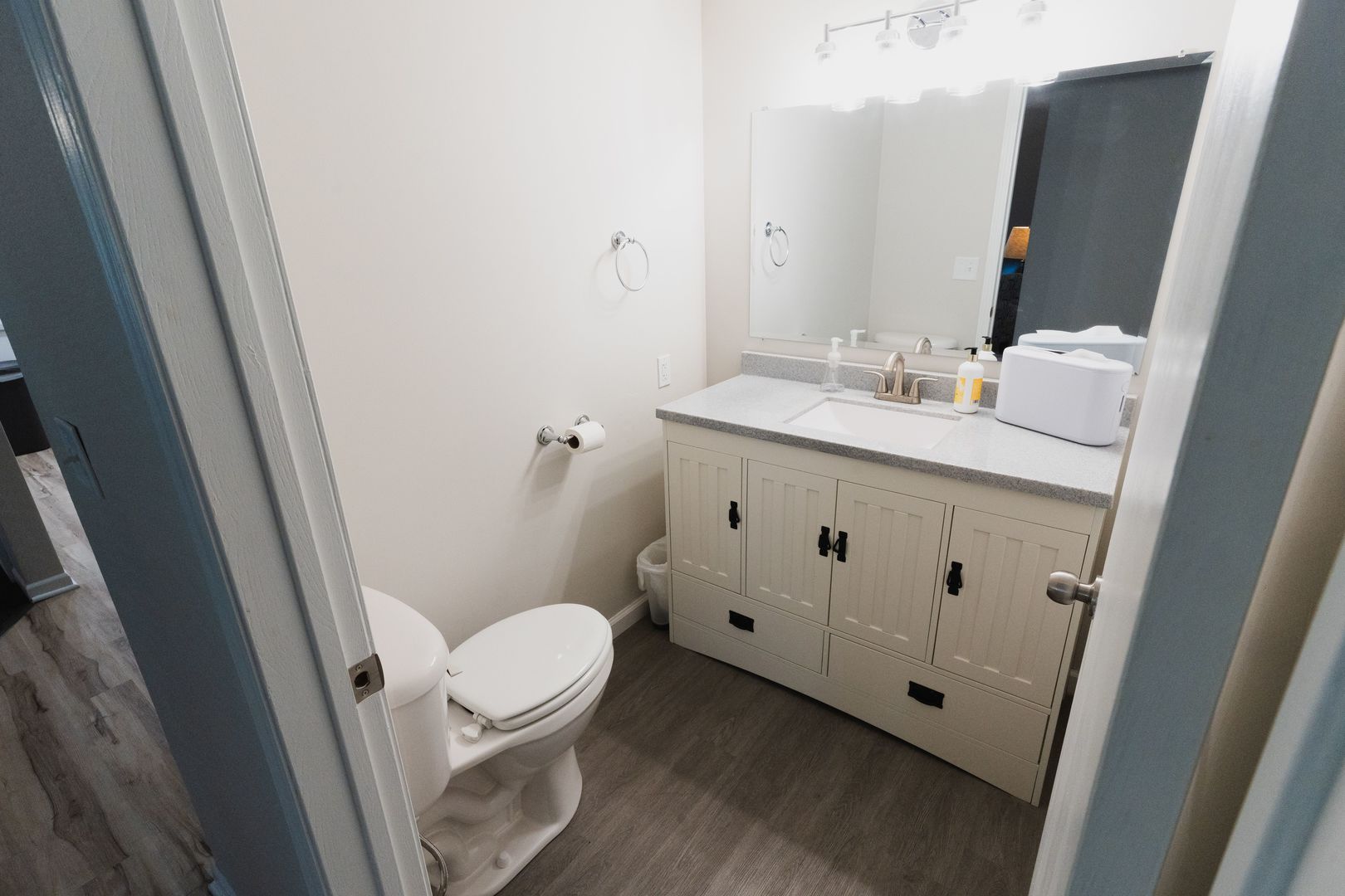 807 3rd Street Durant, IA 52747 - Photo 12 of 23 a bathroom with a sink a toilet and a mirror