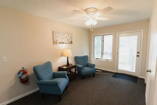 a living room with furniture and a window