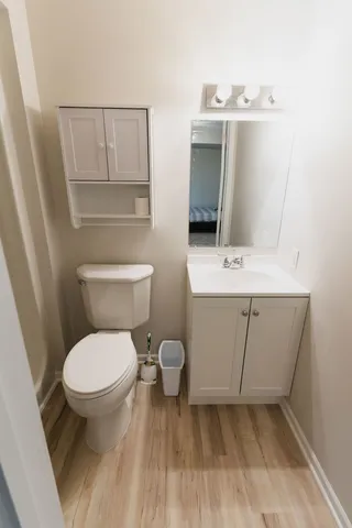 a white toilet sitting next to a bathroom sink