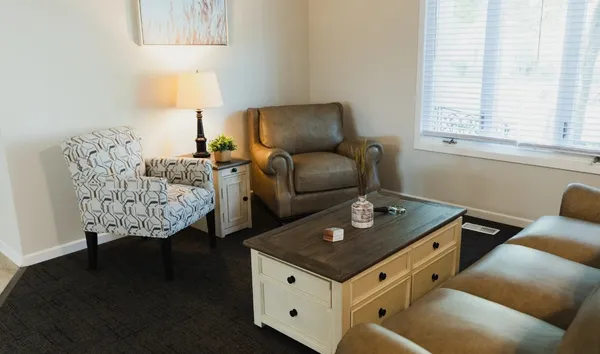 a living room with furniture and a window