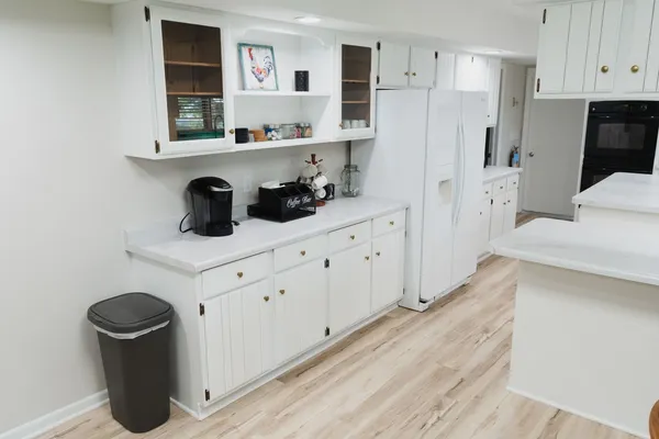 a kitchen with stainless steel appliances a refrigerator and sink