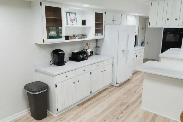 a kitchen with stainless steel appliances a refrigerator and sink