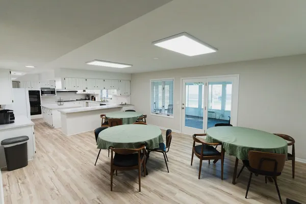 a view of a dining room with furniture and wooden floor