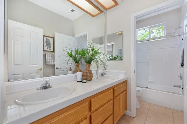 a white bath tub sitting next to a window