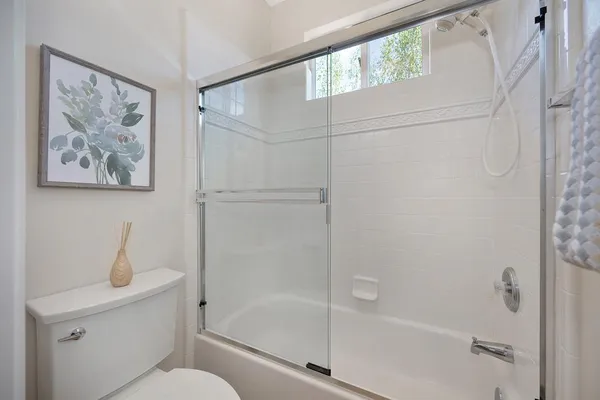 a en suite bathroom with a double sink and mirror