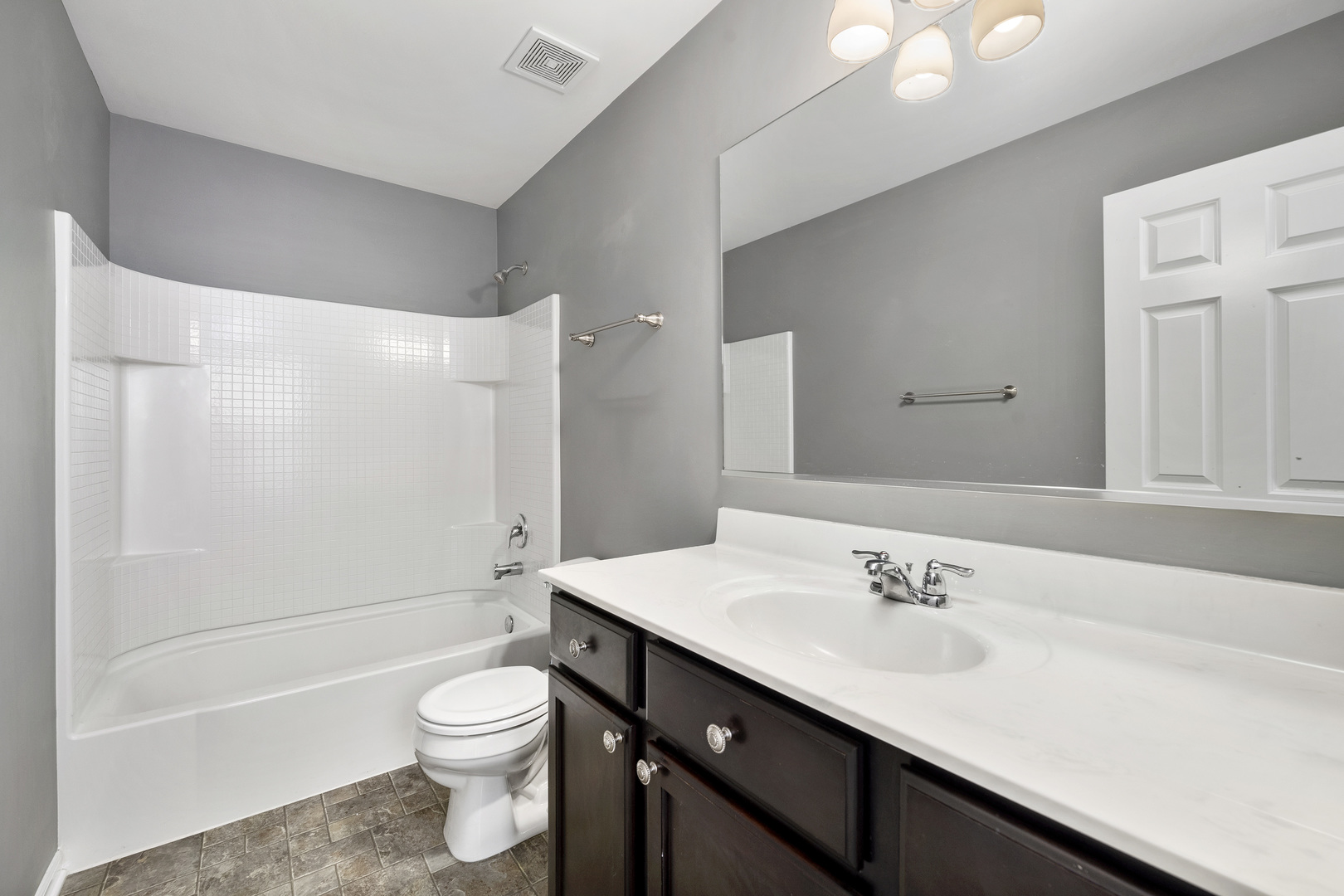 2900 Church Road Aurora, IL 60502 - Photo 11 of 15 a bathroom with a sink a toilet and shower