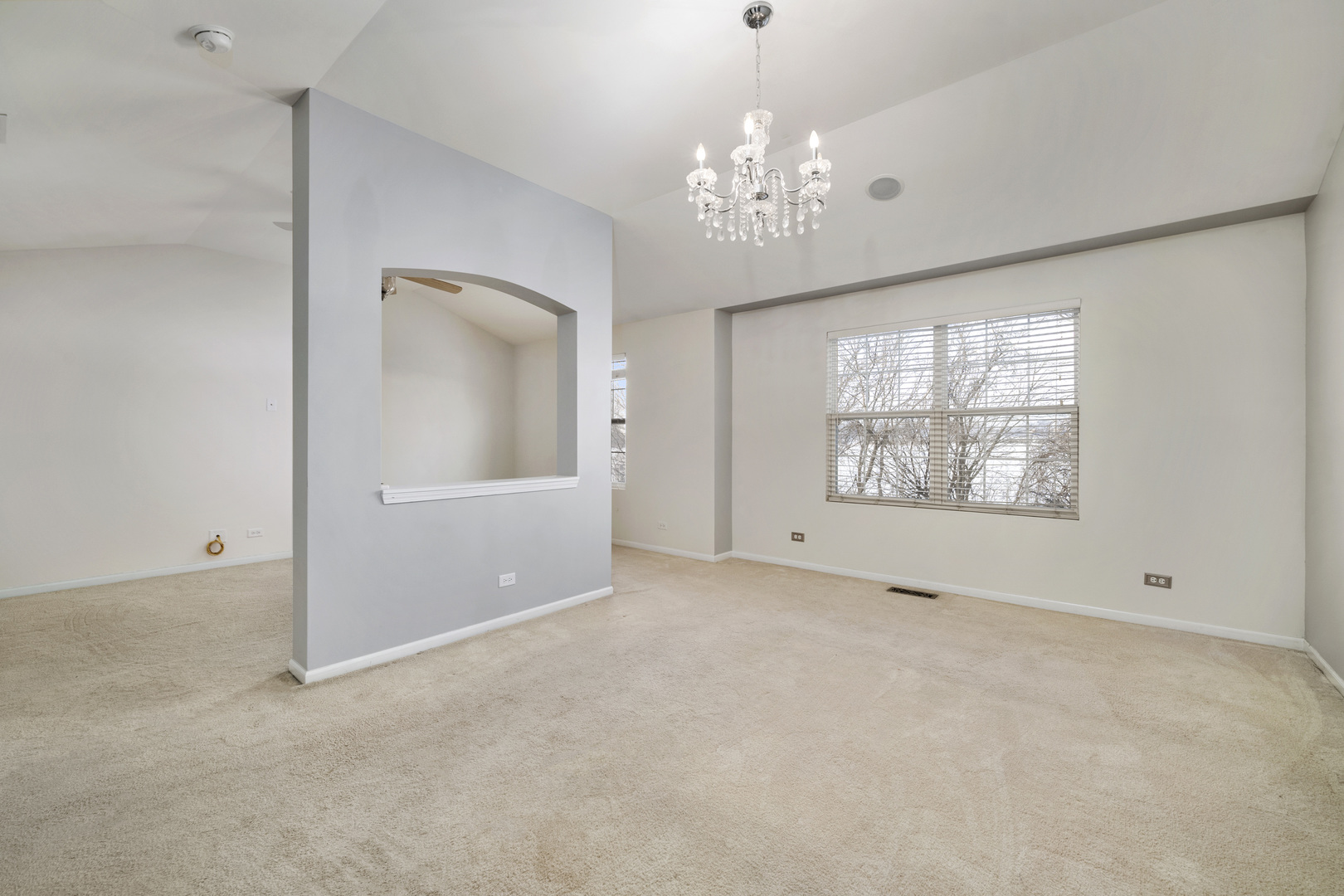 2900 Church Road Aurora, IL 60502 - Photo 8 of 15 en empty room with windows and chandelier