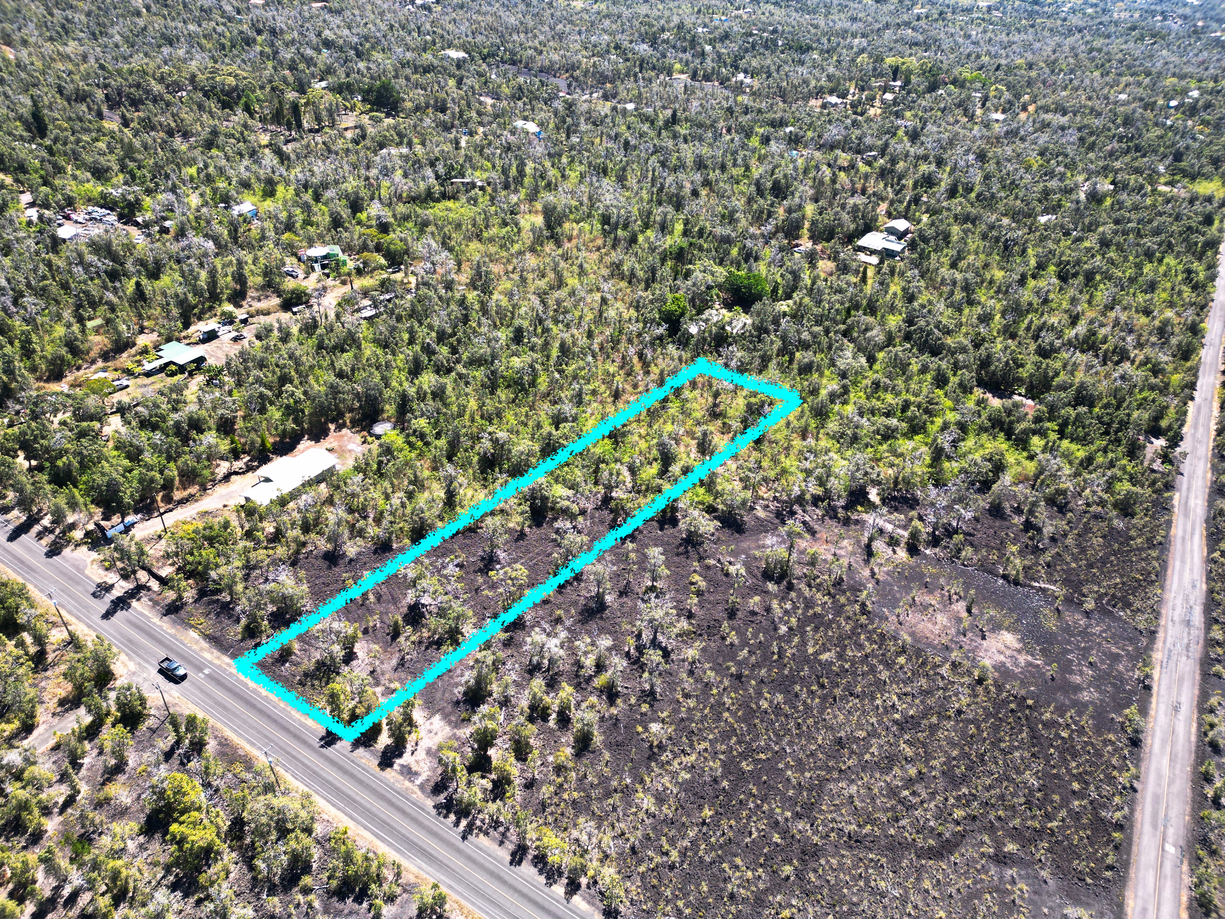 3 Aloha Boulevard Ocean View, HI 96737 - Photo 8 of 14 a green field with flowers and trees