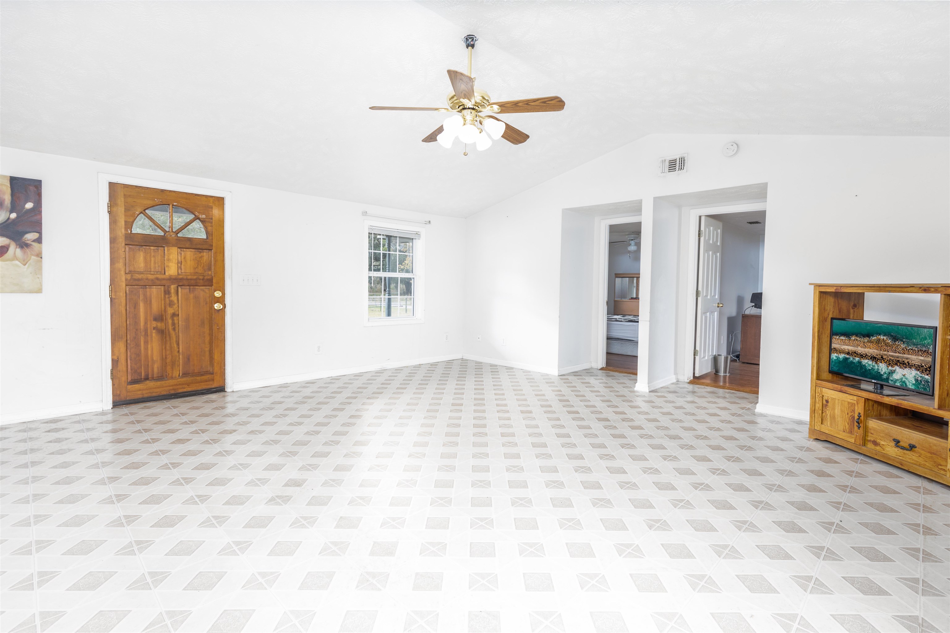 5715 Monroe Smith Road Jacksonville, FL 32210 - Photo 12 of 23 a view of an empty room with a window