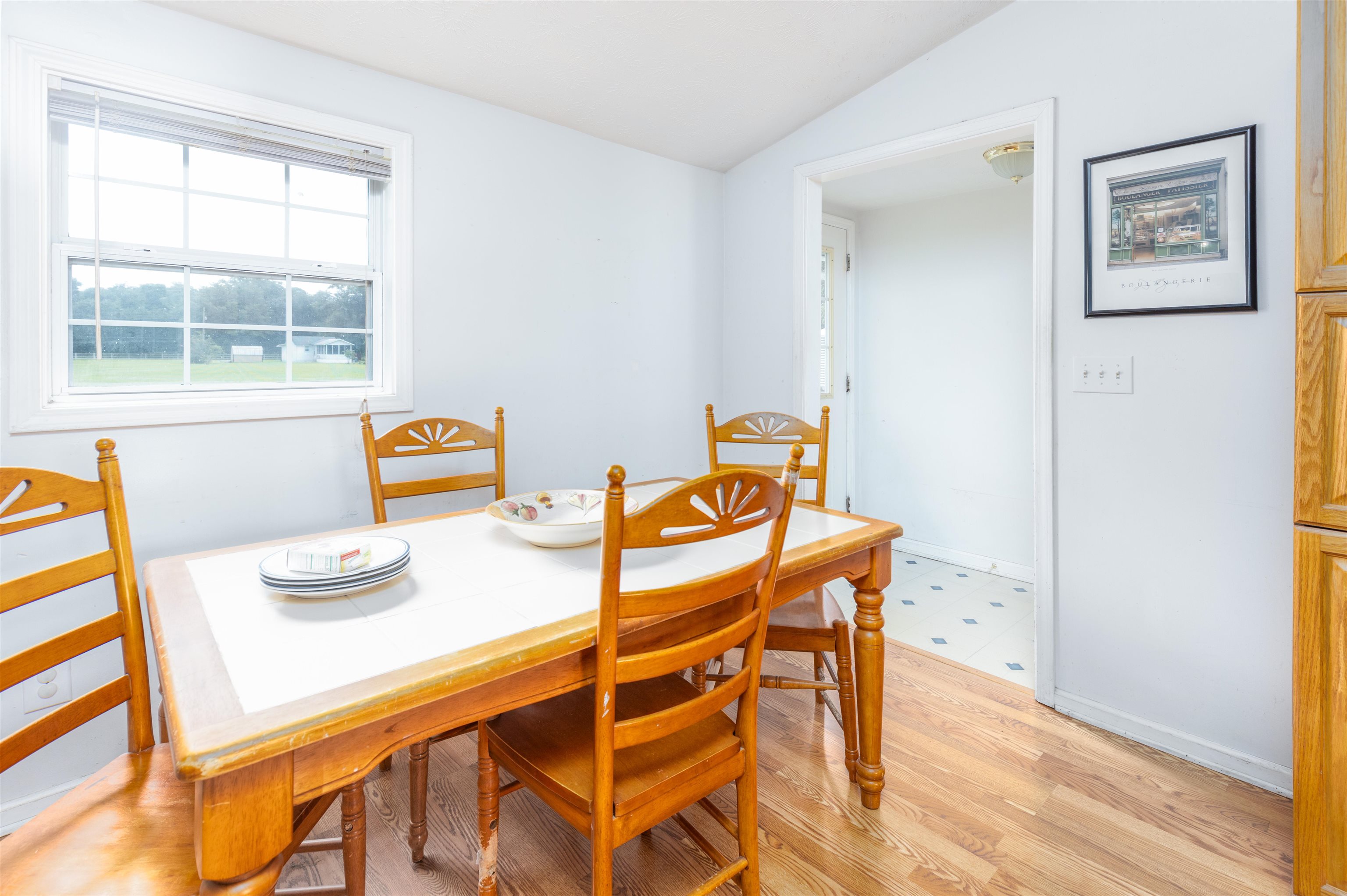 5715 Monroe Smith Road Jacksonville, FL 32210 - Photo 13 of 23 a view of a dining room with furniture and a window