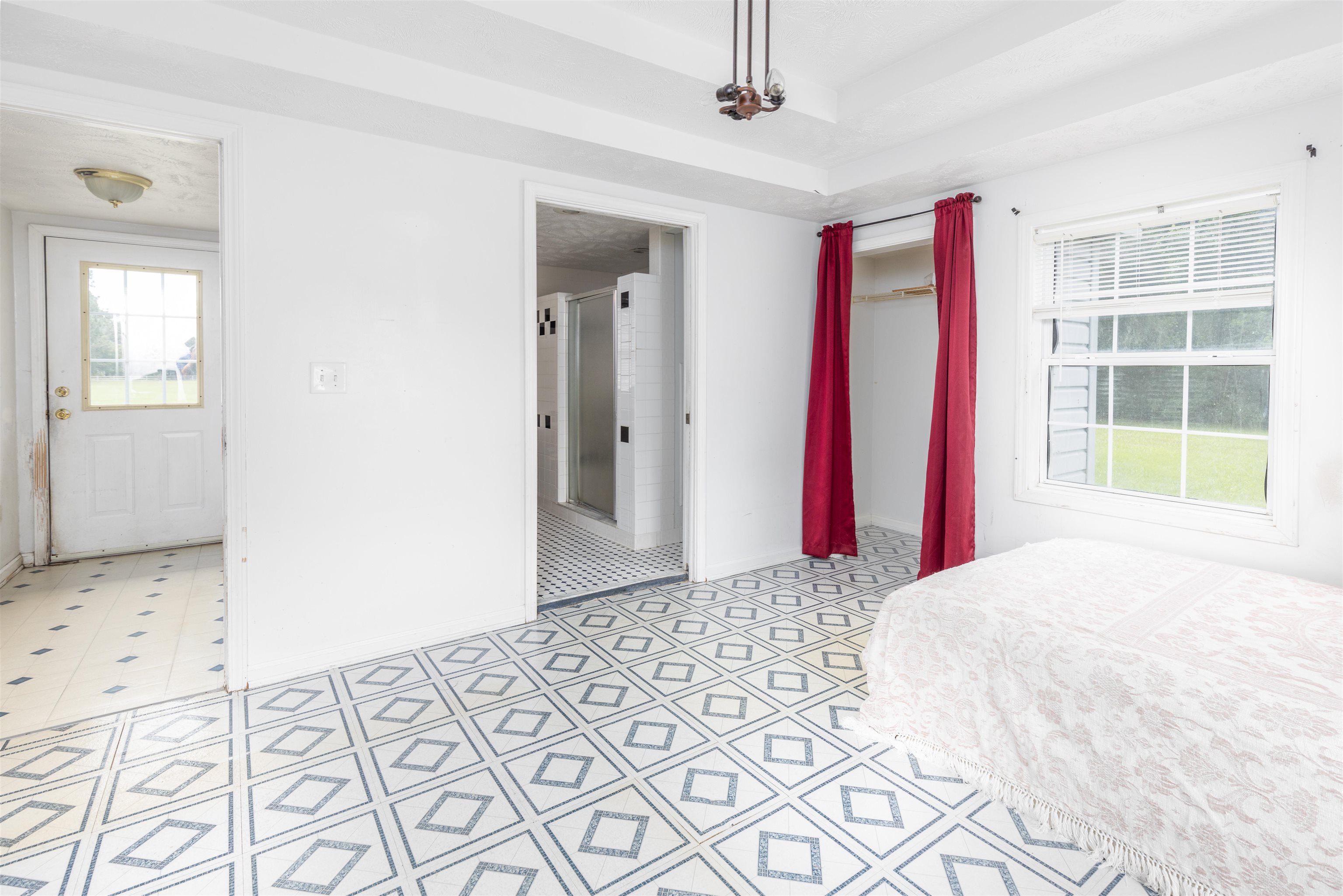 5715 Monroe Smith Road Jacksonville, FL 32210 - Photo 14 of 23 a bedroom with a bed and a window