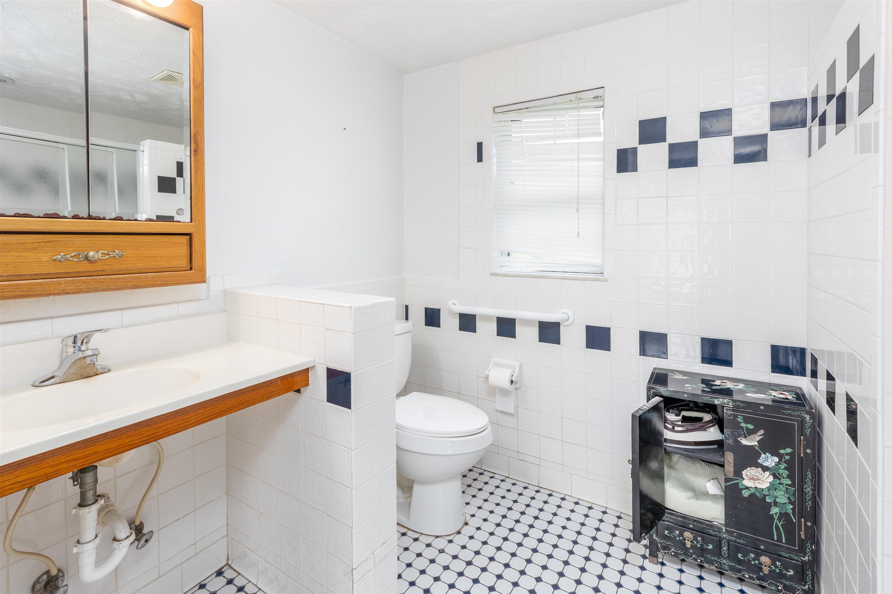 5715 Monroe Smith Road Jacksonville, FL 32210 - Photo 15 of 23 a bathroom with a sink toilet and shower