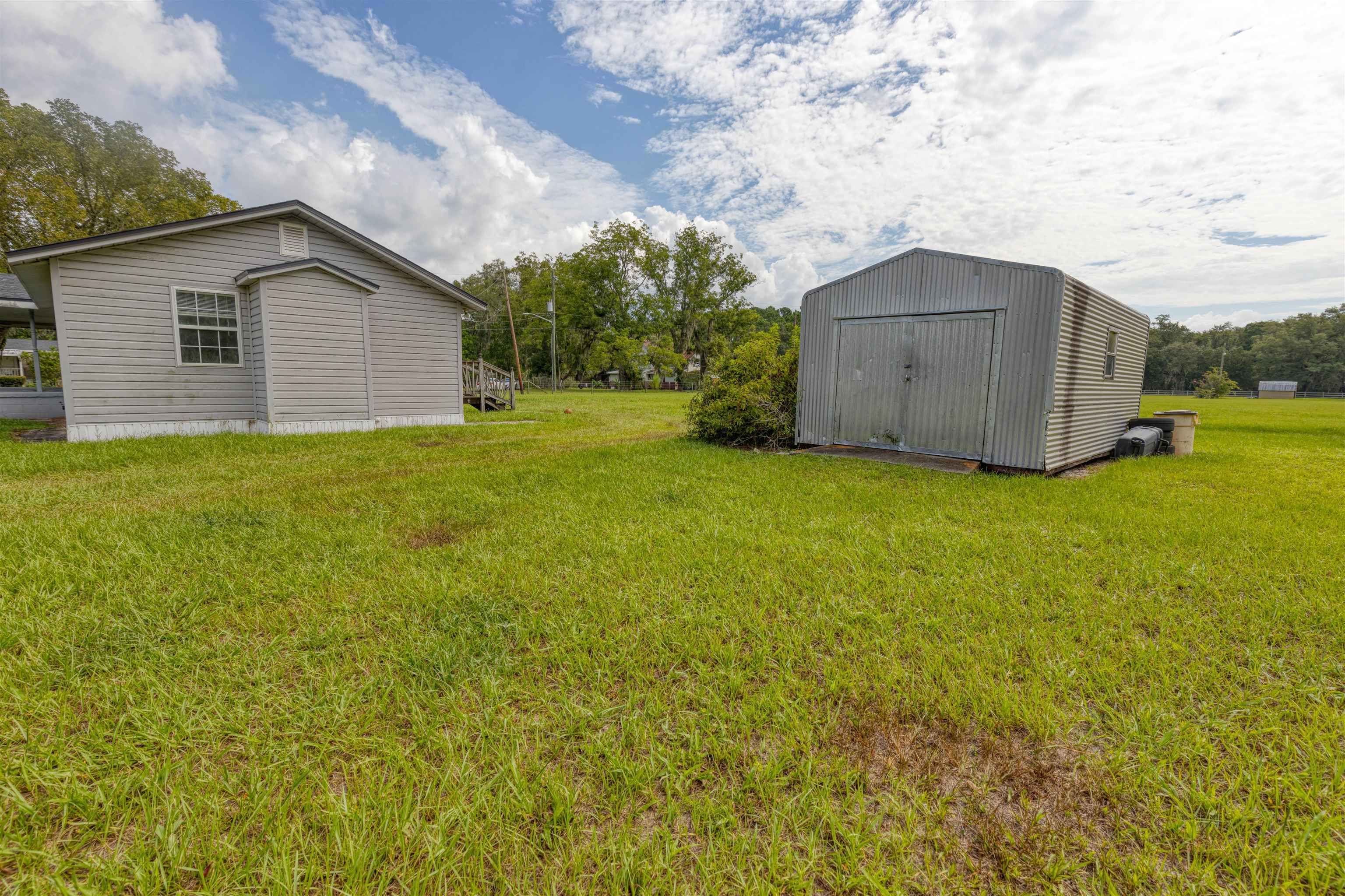 5715 Monroe Smith Road Jacksonville, FL 32210 - Photo 18 of 23 a house view with a garden space